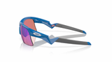 Oakley Capacitor Youth (Klein) Polierter Saphir/Prizm Golf